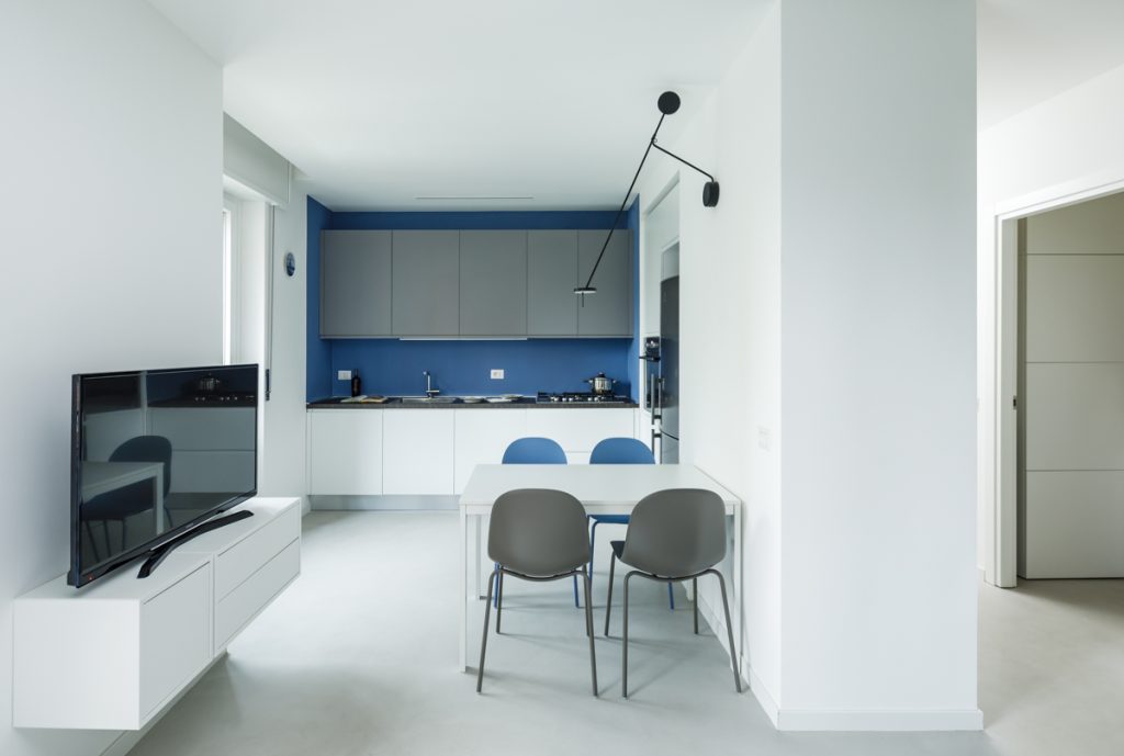 Uptown Folks - Aleksandar Petrov - Modern kitchen with gray and white furniture and blue details