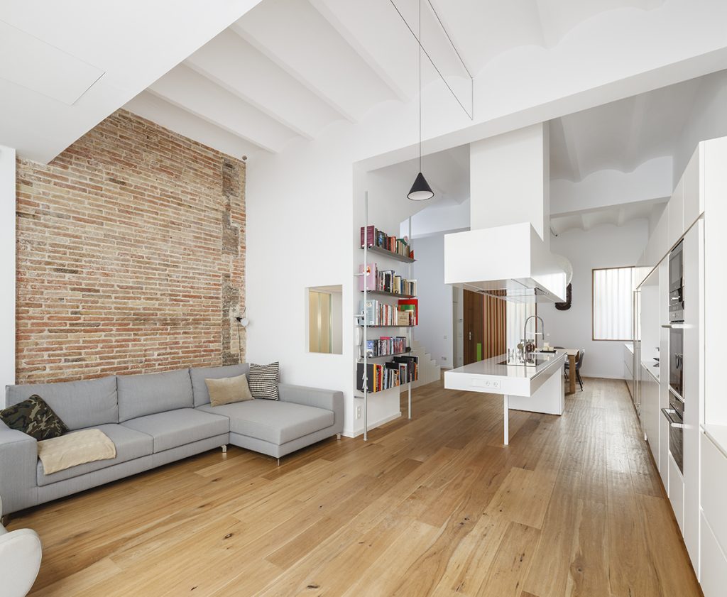House in Barcelona - Blancafort + Reus Arquitectura - Modern, bright living room blends contemporary design with rustic elements, creating a cozy yet chic space