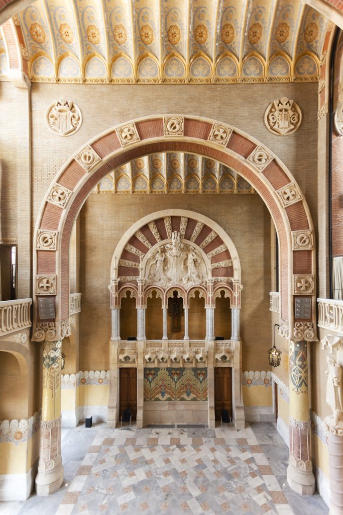 Sant Pau Hospital - ONL Arquitectura - Ornate, architectural interior, rich in intricate designs and warm earth tones, exuding historical elegance